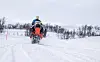 Per Øyvind Haukdal på en rød Ski-Doo sbøscooter i Gauldalsløypa.